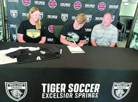 BRAEDYN SEJKORA signs his letter of intent to play men’s soccer and study at Central Methodist University. Watching proudly are (from left) his parents, Makayla and Jason Sejkora. DUSTIN DANNER | Staff