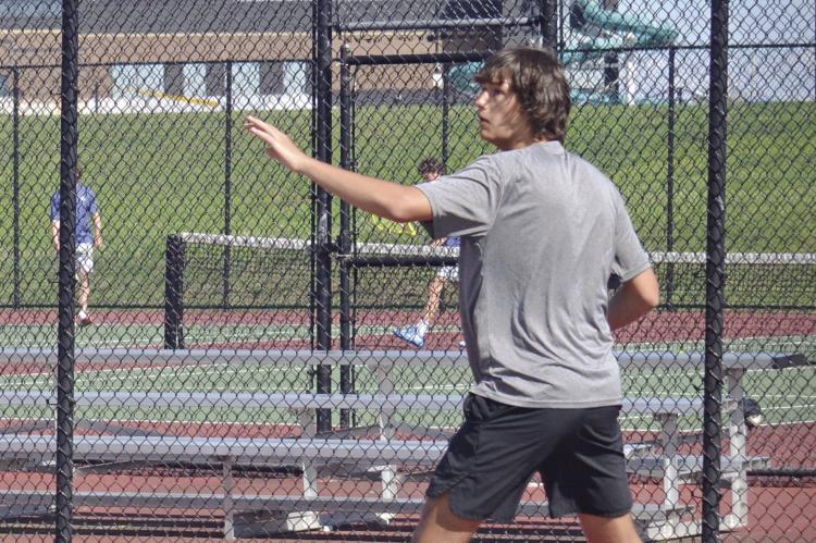 EXCELSIOR SPRINGS junior Owen Peterson keeps his eye on the ball as he hits a forehand shot during a recent home match. DUSTIN DANNER | Staff