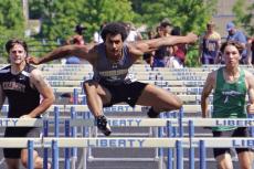 JOSEPH JAMES soars ahead of the field en route to winning the boys 110-meter high hurdles May 11 at Class 4 District 8 competition at Liberty High School. DUSTIN DANNER | Staff