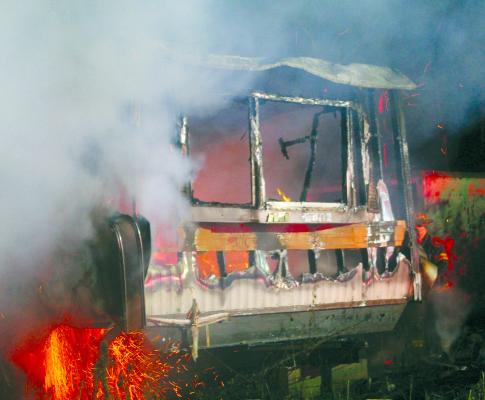THIS TRAILER IS fully engulfed in flames when firefighters arrive on the scene. MIRANDA JAMISON | Staff
