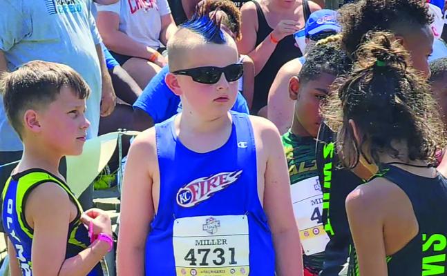 CIAN MILLER socializes before the Junior Olympics competition begins. JOSH MILLER | Submitted