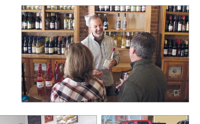 MIRANDA JAMISON | Staff WILLOW SPRINGS MERCANTILE owner Jim Bowman explains wine sampling during Sippin’ into Spring.