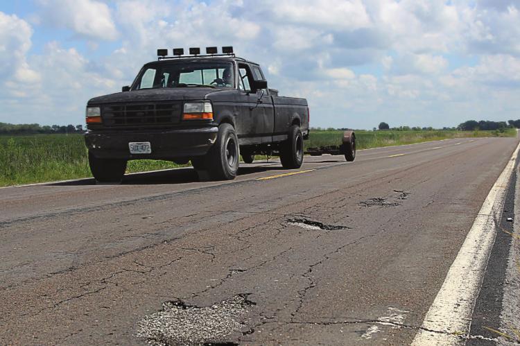 THIS DAMAGE is visible on Route J in southern Ray County. The surface, like surfaces on roads across the Northland, suffers from numerous cracks and potholes, with some of the wear being due to blowups, Missouri Department of Transportation information states. J.C. VENTIMIGLIA | Staff