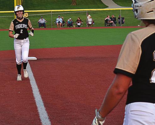 EXCELSIOR SPRINGS junior Mallory Millsap flashes a big smile as she heads for home after driving a game-tying, three-run home run over the right-center field fence Sept. 17 against visiting Oak Grove. DUSTIN DANNER | Staff
