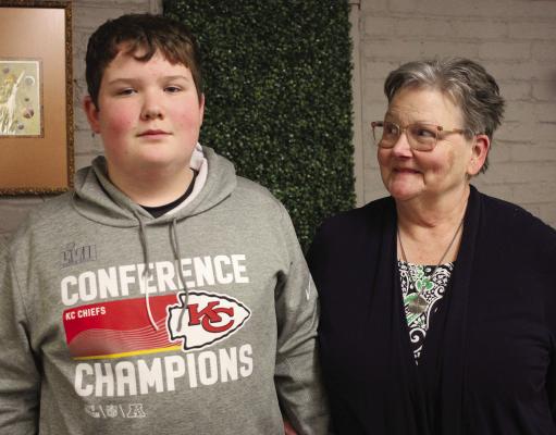 CASH ADAMS, 13, and his grandmother Mary Adams (right) appreciate the community’s support with his injury after the Chiefs rally. SOPHIA BALES | Staff
