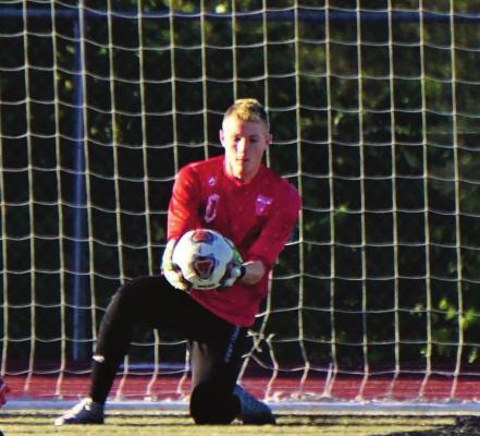JUNIOR GOALKEEPER Braxton Moffet collects the ball as he helps the Tigers win three games last week, including two shutouts. DUSTIN DANNER | Staff