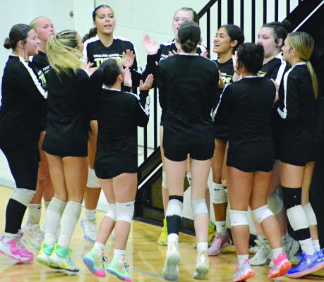MEMBERS OF Excelsior Springs’ varsity volleyball squad gets psyched up for their home match with Kearney. SHAWN RONEY | Staff
