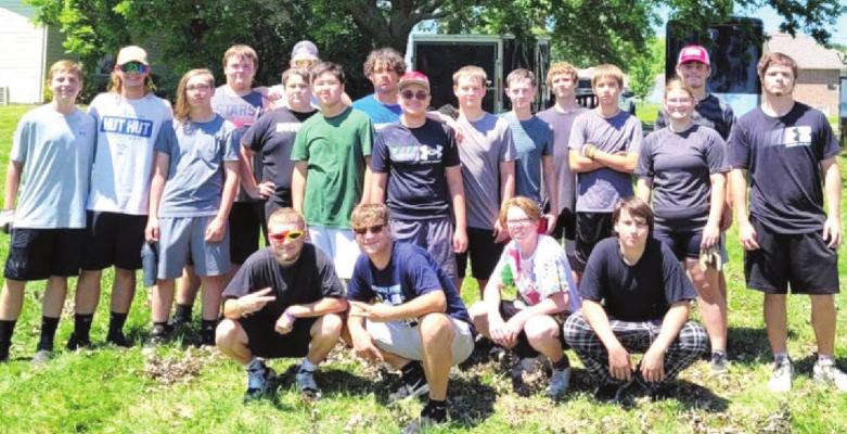 ESHS FOOTBALL teammates gather July 13 for a day of community service, helping 18 families and businesses during the annual Tiger Service Day.