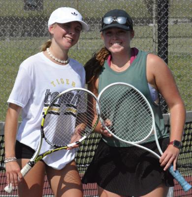 EXCELSIOR SPRINGS is looking to reload, rather than rebuild, with its varsity girls tennis program, thanks in part to international exchange student Alicja Jarosz (left) and junior Laney Smith. SHAWN RONEY | Staff