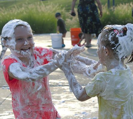 NORA HELMS (left) engages in a foam-covered fight. MIRANDA JAMISON | Staff