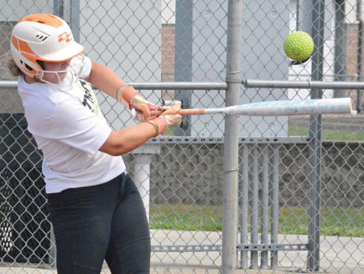 COURTNEY JAMES takes batting practice as Excelsior Springs preps for the varsity softball season. Coach Megan Gilbertson is confident her hitters will “be able to put pressure on opposing pitchers.” SHAWN RONEY | Staff