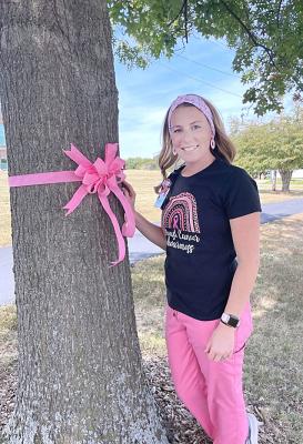 THE EXCELSIOR SPRINGS HOSPITAL campus has been decorated with pink ribbons to remind everyone of Breast Cancer Awareness Month and to remember those who have lost their lives to breast cancer. Courtney Jones, a radiology technician at the hospital, is dressed in pink as a reminder to patients about the month. TARA ALTIS | Staff