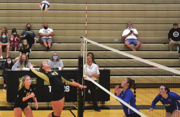 EXCELSIOR SPRINGS senior Rylie Stottlemyre goes up to attempt a kill during a regular-season home varsity volleyball match. DUSTIN DANNER | Staff