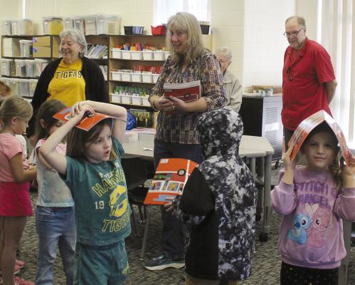 SAINT LUKE’S EPISCOPAL Church and Elks Lodge volunteers distribute donated books to Elkhorn Elementary students. MIRANDA JAMISON | Staff