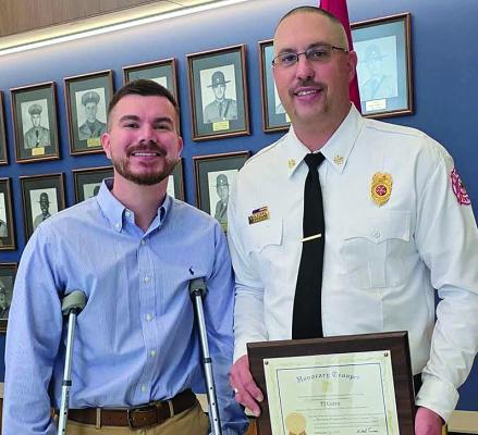 HIGHWAY PATROL CORPORAL Zach Thomas (left) meets Wood Heights Fire Chief T.J. Curry, who was recognized for aiding him at an October crash scene. Submitted