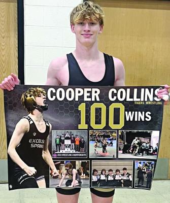 EXCELSIOR SPRINGS junior Cooper Collins enjoys getting his 100th career high school wrestling victory, secured during a home dual with Grandview. Wrestling coverage continues on page 12. DUSTIN DANNER | Staff