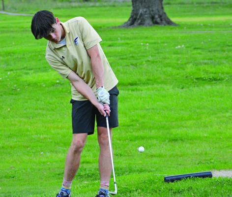 EXCELSIOR SPRINGS junior Gage Simmons attempts a chip shot during the Richmond Invitational April 28 at Shirkey Golf Course. SHAWN RONEY | Staff