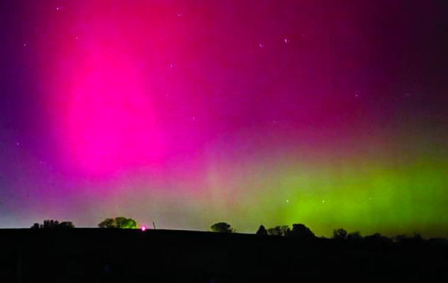 VIBRANT PINK AND green hues from the northern lights glow above Excelsior Springs as a geomagnetic storm brings a rare aurora display to the region. LEE O’DELL | Submitted