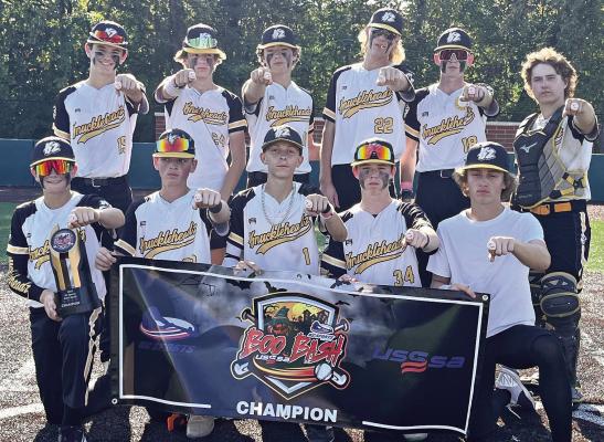 THE KNUCKLEHEADZ display their Boo Bash age-division championship banner. First row (from left), Henry Crowley, Conor Eich, Jaxon Hellyer, Brighton Hibschle, Landon Chaffin; second row, Kaden Verdi, Ethan Austin, Cruz Lloyd, Josiah Hamann, Jeyden Donley, Mikhai Knapp. DUSTIN DANNER | Staff
