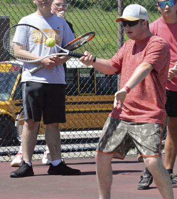 DANTIN McBEE looks to hit a forehand shot as he and other Excelsior Springs student athletes particiapte in a high school tennis camp. SHAWN RONEY | Staff