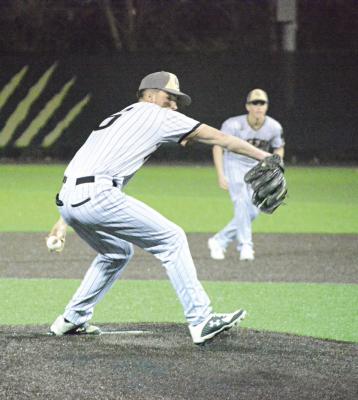 COLSON MOORE delivers in the seventh inning of the finale of Excelsior Springs’ Tuesday night home doubleheader.