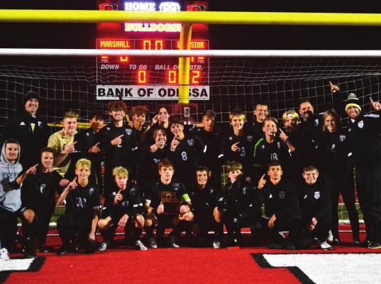 THE EXCELSIOR SPRINGS varsity boys soccer team basks in the glow of winning the Class 2 District 6 Tournament title for the program’s first district championshp since 2015. DUSTIN DANNER | Staff