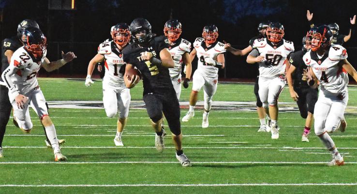 SENIOR LUKAS SHELTON finds running room for the Tigers during their Oct. 8 homecoming meeting with Missouri River Valley Conference Division foe Oak Grove. TARA ALTIS | Staff