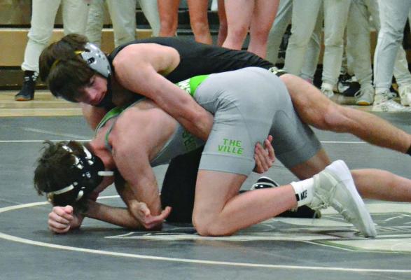 RYNE MARCUM, an Excelsior Springs junior, gains control during his match with Smithville’s Ben Woody Jan. 3 at Smithville in a Greater Kansas City Suburban Conference-Blue Division dual. DUSTIN DANNER | Staff