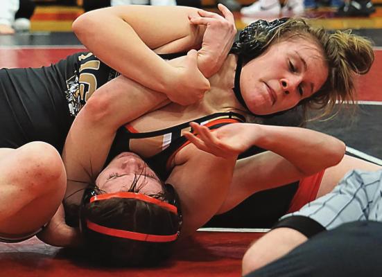 EXCELSIOR SPRINGS junior Vada Burton picks up a win by fall Jan. 14 during the Missouri River Valley Conference girls wrestling tournament at Odessa High School en route to a 130-pound division title. DUSTIN DANNER | Staff