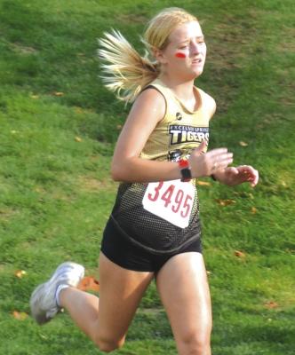 SENIOR BRAYLISSA WHITWORTH strides downhill as she approaches the finish line Oct. 3 at the Excelsior Springs Cross Country Invitational. DUSTIN DANNER | Staff