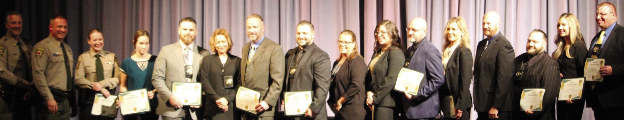 CLAY COUNTY Sheriff Will Akin presents a Special Commendation Award to a group of Clay County investigators for their work in an operation that led to the arrests of three men who were seeking to sexually exploit children. MIRANDA JAMISON | Staff