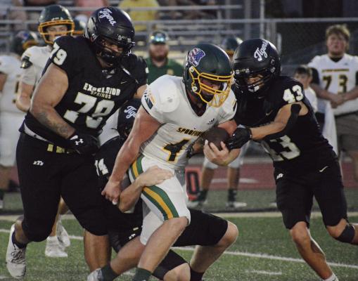 MATHEW SHOUSE (left) and Owen O’Dell (right) help stop Maryville’s attack during Excelsior Springs’ home opener in varsity 11-man football. Excelsior Springs football coverage continues on page 8. SHAWN RONEY | Staff