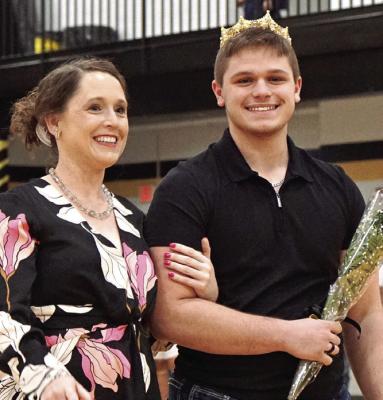 OWEN ANDREASEN (right) enjoys being crowned Excelsior Springs courtwarming king while accompanied by his mother, Dr. Katie Andreasen.