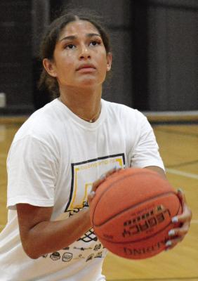 LARA HUTTON prepares to shoot during an Excelsior Springs girls basketball camp session. SHAWN RONEY | Staff