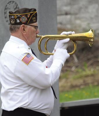RON WETZEL plays taps during the Memorial Day ceremony. MIRANDA JAMISON | Staff