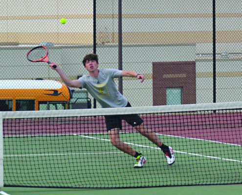 EXCELSIOR SPRINGS senior Ethan Sams leans to return a forehand winner April 24 against visiting Odessa. DUSTIN DANNER | Staff