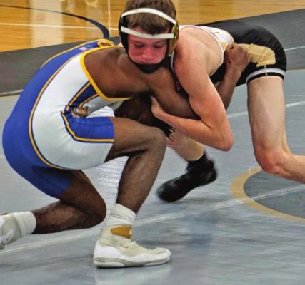 EXCELSIOR SPRINGS junior Landen Davis gains controls of his opponent from Center during Jan. 21 home dual action. DUSTIN DANNER | Staff