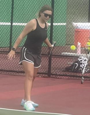 SENIOR MEGAN RIEGEL, shown recently working on her forehand shot, is part of a group of returning players looking to help Excelsior Springs win another district girls tennis title. DUSTIN DANNER | Staff
