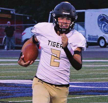 JUNIOR QUARTERBACK Chance Moreland heads to the corner on one of his long runs during Excelsior Springs’ 35-26 Sept. 24 Missouri River Valley Conference West Division road win over Harrisonville. DUSTIN DANNER | Staff