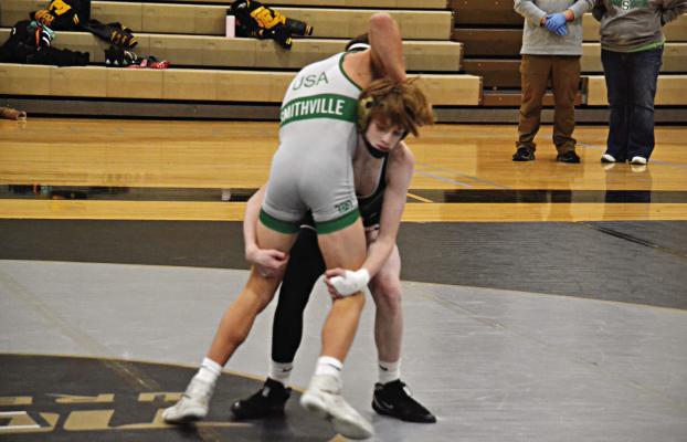 COOPER COLLINS, a first-year high schooler at Excelsior Springs, gains control and then lifts his opponent for a takedown during the Tigers’ Jan. 4 home dual with Smithville. DUSTIN DANNER | Staff