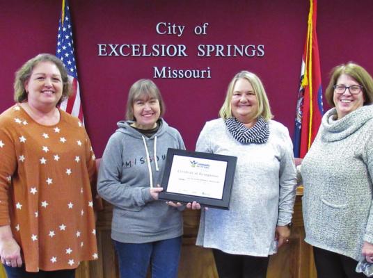 RECEIVING the award on behalf of the city are, from left, City Clerk Shannon Stroud, Mayor Pro-Tem Sonya Morgan, Mayor Sharon Powell and City Manager Molly McGovern.