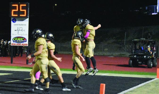 THE TIGERS celebrate in the end zone after scoring a touchdown during their 41-14 Greater Kansas City Suburban Conference-Blue Division and Senior Night victory over visiting Ruskin of Kansas City. TARA ALTIS | Staff