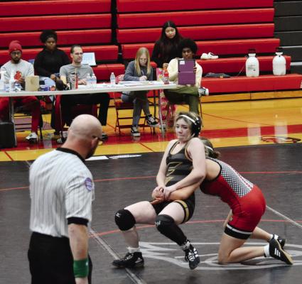 SOPHOMORE Lauren Park gets to her feet and tries to escape during Excelsior Springs’ 28-27 dual victory Feb. 1 at Raytown South. DUSTIN DANNER | Staff