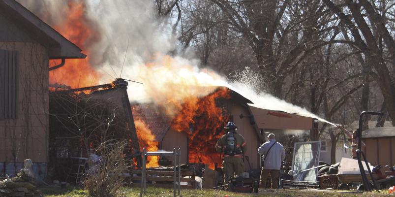 FISHING RIVER Fire Department and Excelsior Springs Fire Department work together to put out a fully engulfed structure fire. MIRANDA JAMISON | Staff