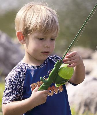 WAYLEN LITTLE checks his fishing line before making another cast.