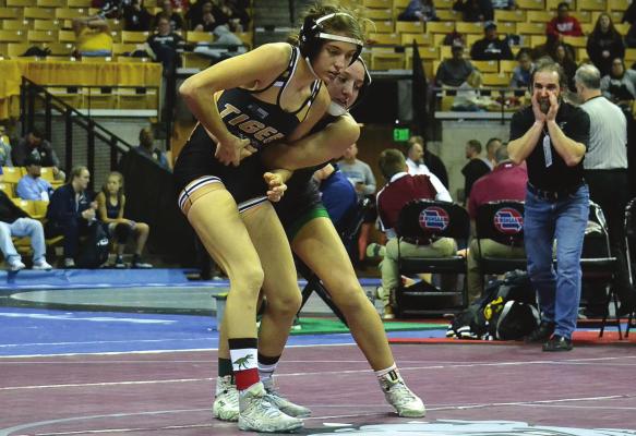 EXCELSIOR SPRINGS senior Jacey Brewer works for an escape against eventual state champion Nadia Middendorf of Parkway South. DUSTIN DANNER | Staff