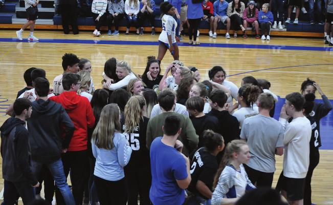 FANS STORM the court after Excelsior Springs wins the 2018 Class 3 District 15 volleyball title in October at St. Pius X of Kansas City. Led by coach Terri Irons, one of this year’s ESHS Athletic Hall of Fame inductees, the Tigers reach the state quarterfinals, where they fall to Pleasant Hill SHAWN RONEY | Staff