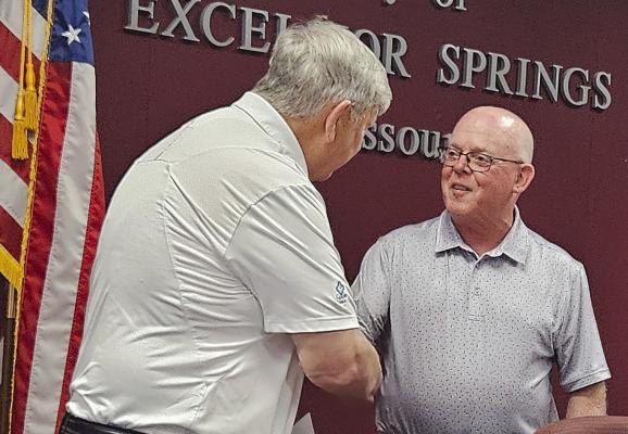 EXCELSIOR SPRINGS Mayor Mark Spohn (right) formally presents Councilman John McGovern with the World Elder Abuse Awareness Day proclamation. Spohn then expresses his gratitude to McGovern for graciously accepting the proclamation on behalf of the city’s revered elders. MIRANDA JAMISON | Staff