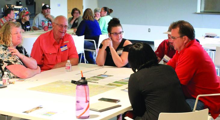 SOPHIA BALES | Staff CHAD BIRDSONG, public works director (far right) is one of the speakers during the breakout discussion section of Excelsior’s Watershed Study Workshop, held Sept. 7 at the community center.