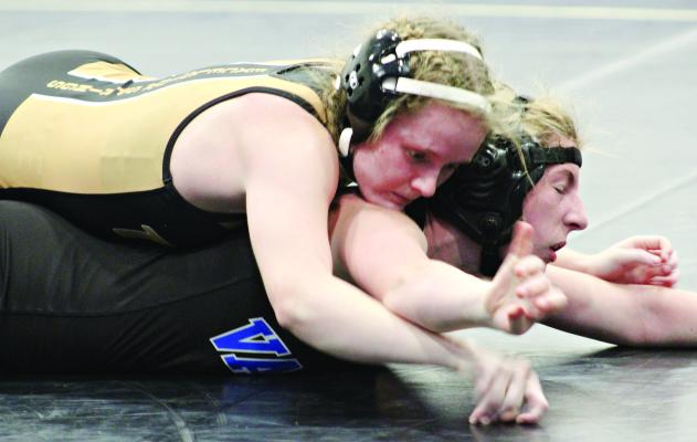 JAYLENN HUDLEMEYER works to gain hand control while on top during the 125-pound title match at the Steve Leslie Inivtational Dec. 1 at Pleasant Hill. DUSTIN DANNER | Staff